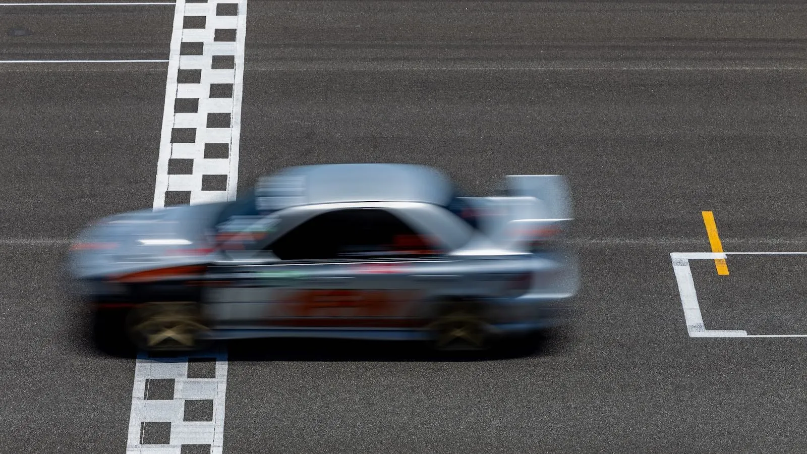 Race car crossing the finish line, the article's analogy for how SEO wins the race for rankings